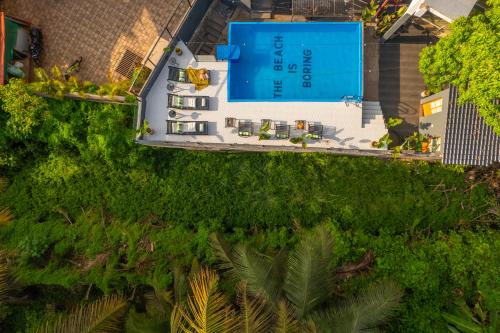 an overhead view of a house with a swimming pool at Minimalist Panjim in Marmagao
