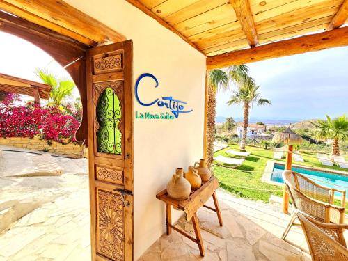 a entrance to a villa with a view of a pool at B&B La Nava Suites in Mojácar