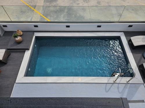 an overhead view of a swimming pool in a house at Dimitra's Paradise Villa in Lygia