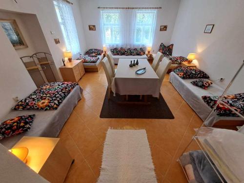 a large room with couches and a table and chairs at Chalupa u Dionýza in Rejdová