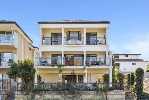 an apartment building with balconies and trees at WOOD14 - River Suite in Perth
