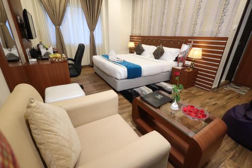 Hotel Sidh Vedanthaにあるベッド