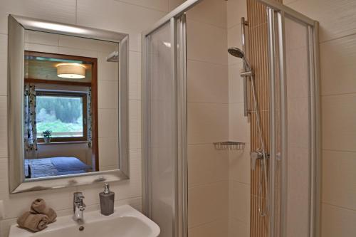 a bathroom with a sink and a shower at Apartment Alpenwelt in Neustift im Stubaital