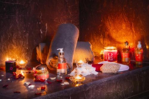 a table with a skateboard on it with lit candles at Riad Sybil Boutique Hotel in Marrakech