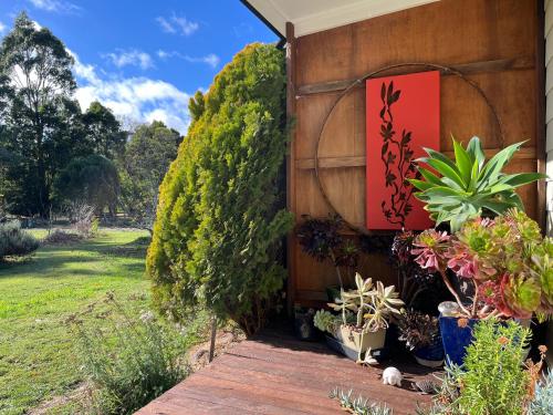 a garden entrance to a house with plants at Wombat Forest Country Retreat in Trentham East