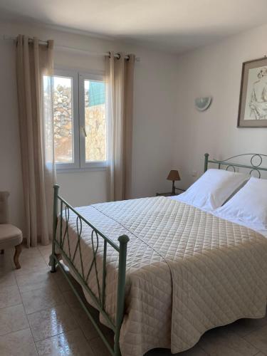 מיטה או מיטות בחדר ב-Appartement rez de villa