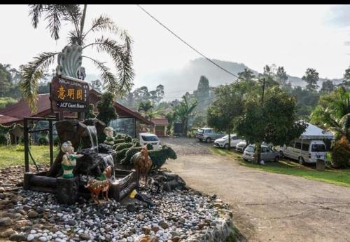 a figurine of people and animals on a road at ACF Guest House in Sungai Lembing