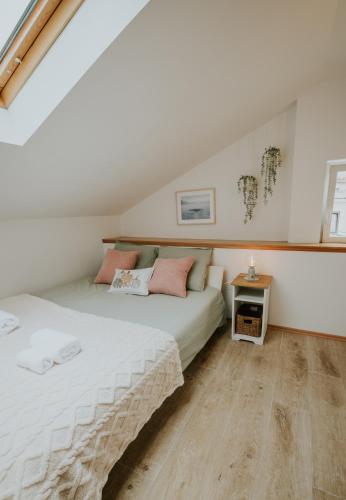a bedroom with two beds in a attic at Holiday home VITAS in Bakar
