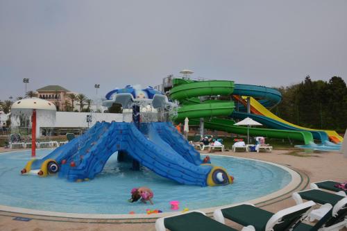 a water slide in a pool in a water park at Valeria Jardins d'Agadir - All In in Agadir