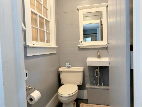 a bathroom with a toilet and a sink at NH311B Nags Head 311B in Nags Head