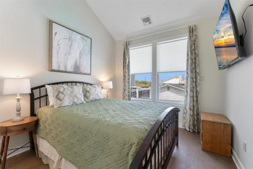 a bedroom with a bed and a large window at 309 E Jefferson Ave in Wildwood Crest