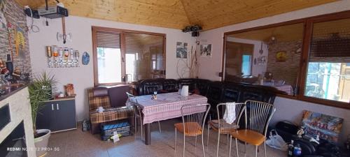 a room with a table and chairs in a room at Vila Natasa&Sofia in 2 Mai