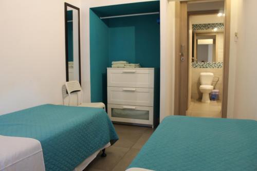 Katil atau katil-katil dalam bilik di Rainbow Apartments