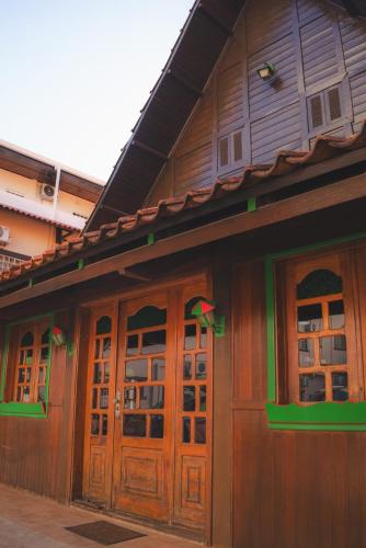a building with wooden doors and windows at Italian Palace Hotel in Sinop