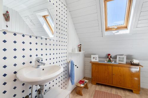 a bathroom with a sink and a mirror at Ferienhaus Charlotte in Zell am Harmersbach