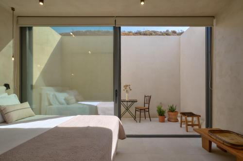 Cama o camas de una habitación en Homatinos Villa, a SeaView Sanctuary with 2 Pools, By ThinkVilla