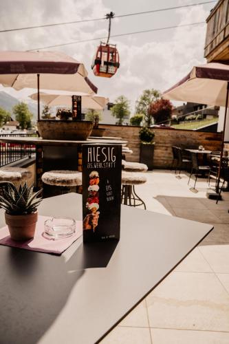 a sign sitting on a table at a restaurant at LaMonte Luxury Apartments in Kitzbühel