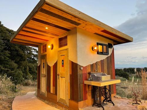 a small house with a roof on top of it at Yamamizuki in Shimanto