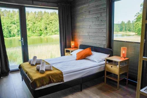 Postel nebo postele na pokoji v ubytování Ruciane Park - Mazury resort & spa