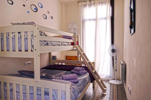 Postel nebo postele na pokoji v ubytování La LLar de la Kim, Bonita casa a 150m del mar y 40km de Barcelona