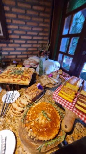a table topped with lots of different types of food at Italian Palace Hotel in Sinop