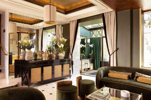 a living room with a couch and a table at Lord Byron in Paris