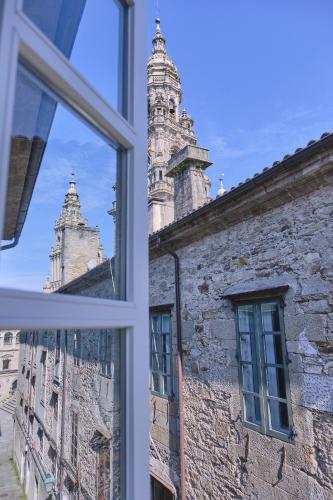 a view from a window of a building with turrets at Hotel Praza Quintana in Santiago de Compostela