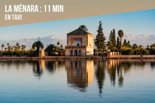 a building in the middle of a body of water at Magnifique appartement moderne de 2 chambres avec piscine à 10 min du centre de Marrakech in Marrakech