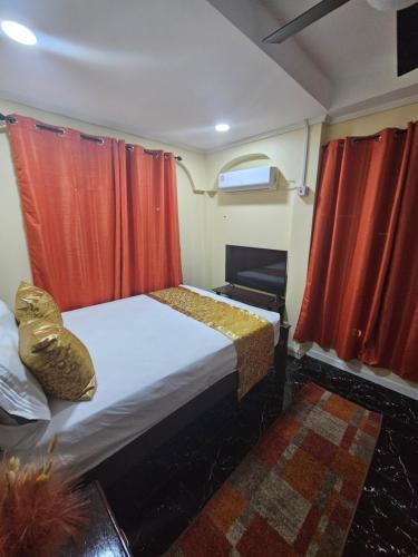 Ένα ή περισσότερα κρεβάτια σε δωμάτιο στο Beulah Luxury Suites