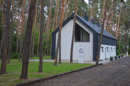 a small building in the middle of a forest at Karłowy Las in Milicz