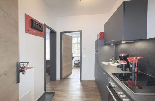 a kitchen with a sink and a stove top oven at Ferienquartier Forsthaus 2 in Bad Gottleuba