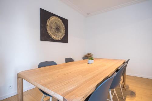 a conference room with a wooden table and chairs at Amandine - Luxury 3 bedrooms apartment with free parking in Ostend