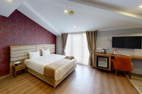 מיטה או מיטות בחדר ב-King City Hotel