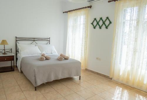 Ένα ή περισσότερα κρεβάτια σε δωμάτιο στο Bay View Villa