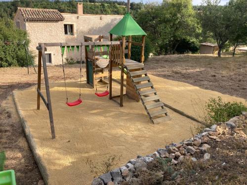 a playground with a ladder and a swing at Le Domaine de Piedmoure, Gîtes et chambres, piscine, terrasses privatives in Sault-de-Vaucluse