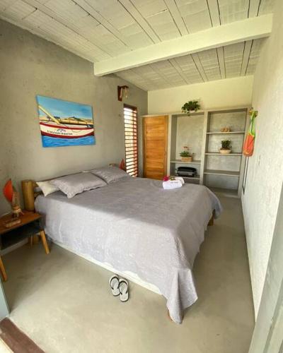 Ένα ή περισσότερα κρεβάτια σε δωμάτιο στο CMB House