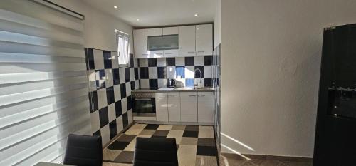 Kuchyň nebo kuchyňský kout v ubytování Aphrodite Apartment