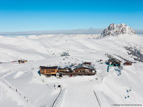 a ski lodge in the snow on a mountain at Apartment Althaus by Interhome in Neukirchen am Großvenediger