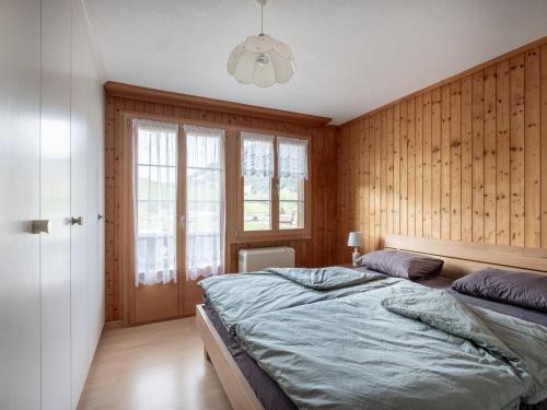 Postel nebo postele na pokoji v ubytování Apartment Chalet Anita by Interhome