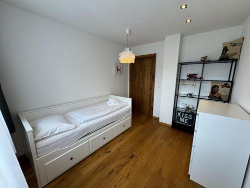 a bedroom with a bed in the corner of a room at Holiday Home Skyline Retreat by Interhome in See