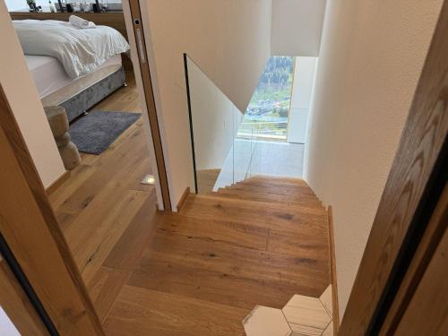 a stairway leading to a bedroom with a bed at Holiday Home Skyline Retreat by Interhome in See
