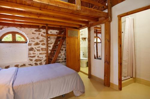 מיטה או מיטות בחדר ב-Cortijo el Soto