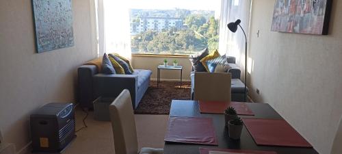 Khu vực ghế ngồi tại Acogedor Apartamento, rodeado de Naturaleza y Mar.