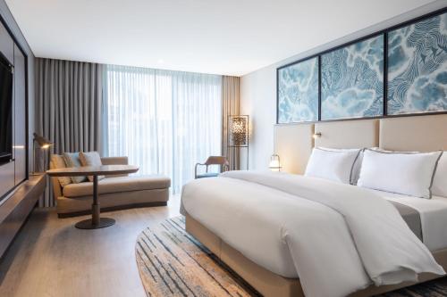 a hotel room with a large bed and a tv at The Westin Istanbul Nisantasi in Istanbul