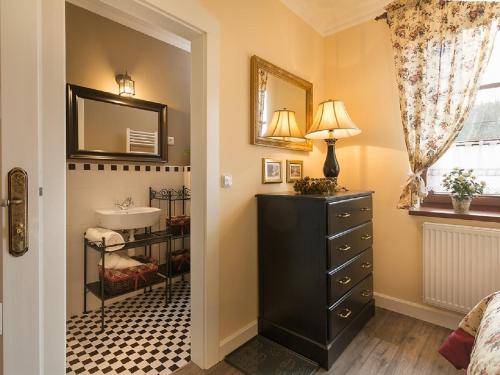 a bathroom with a sink and a mirror at Holiday Home Huty by Interhome in Jimramov