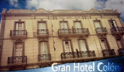 a building with balconies on the side of it at Gran Hotel Colón in Villa María