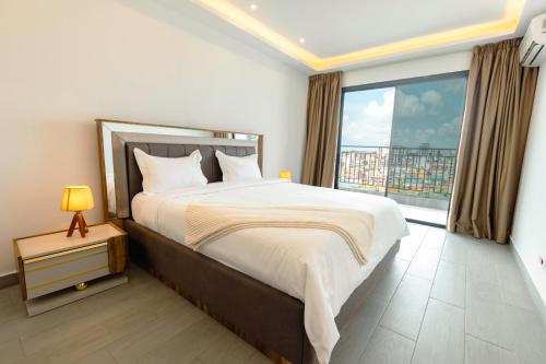 Postel nebo postele na pokoji v ubytování Lumina Suites