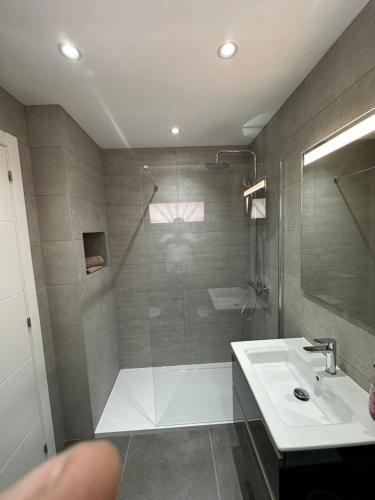 a bathroom with a shower and a sink at CASA JAMACO, Corralejo in Corralejo
