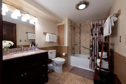 a bathroom with a sink and a toilet and a shower at Tamarron Gambel Oak 790 - Wild Turkey Ridge - Durango CO in Coffeyville