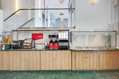 a counter in a room with a counter sidx sidx at Wyndham Garden Brooklyn Sunset Park in Brooklyn